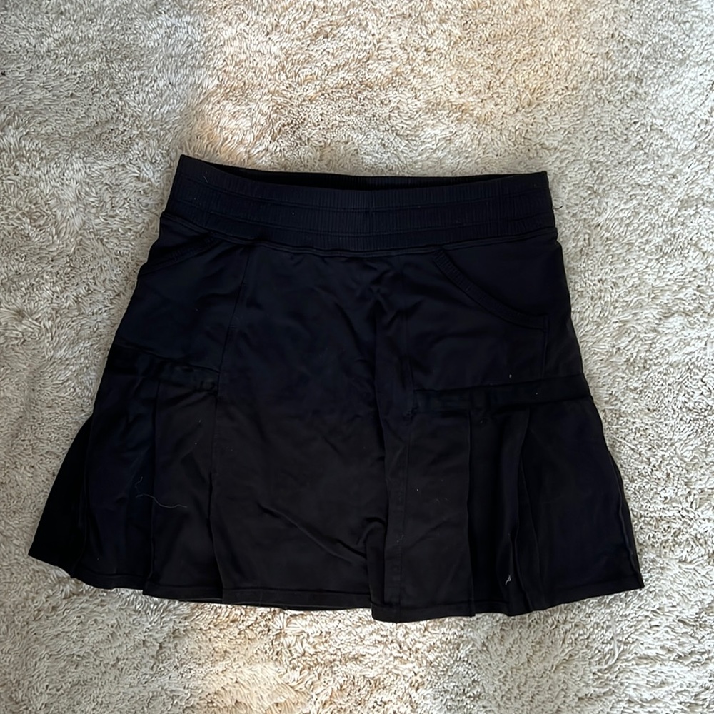 Athleta black tennis skirt with built in shorts and a back zipper